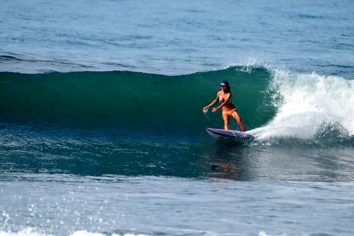 Four-time world surfing champion Frieda Zamba riding a clean green wave behind Casa Lapa in Playa Hermosa