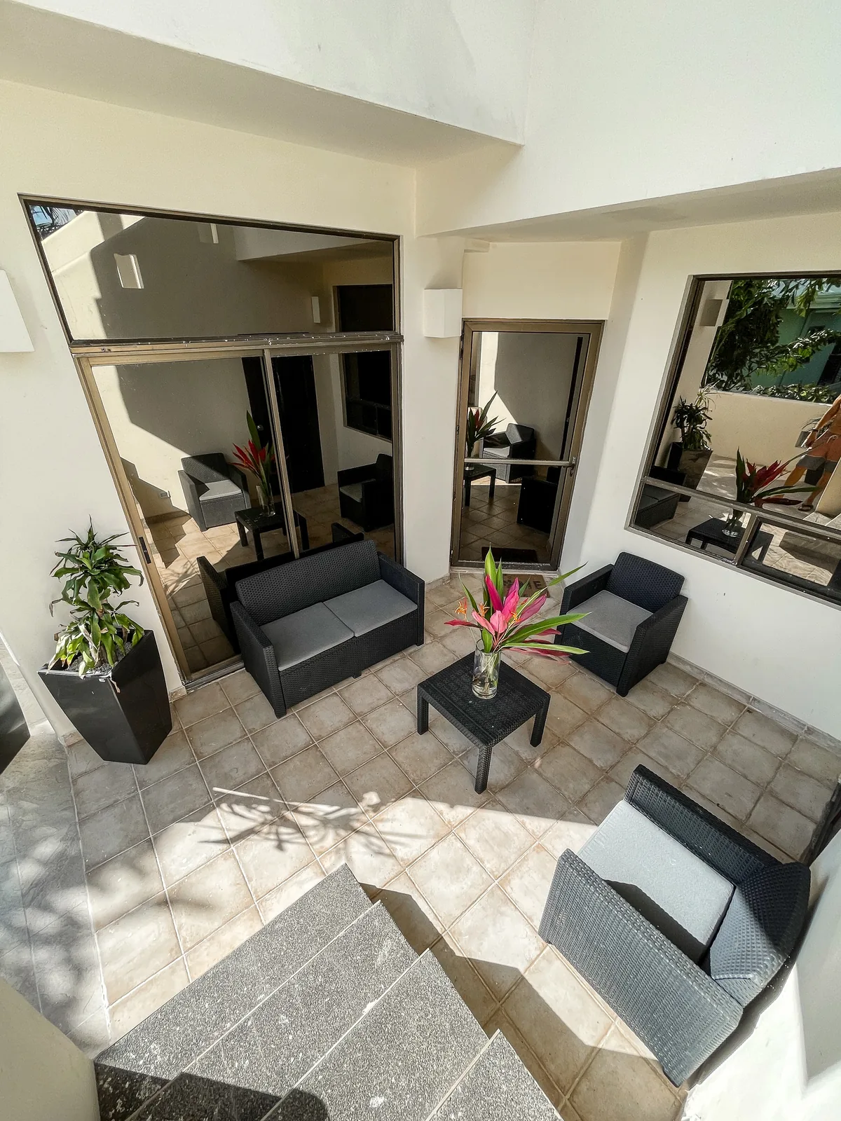 Ocean-View Three-Bedroom – shared patio lounge 01